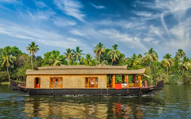 Houseboat trip Alleppey through the tranquil Kerala backwaters.
