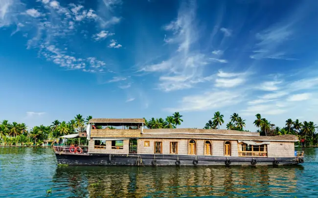 Houseboat trip Alleppey through the tranquil Kerala backwaters.